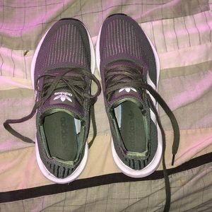 Adidas olive green and white sneakers.